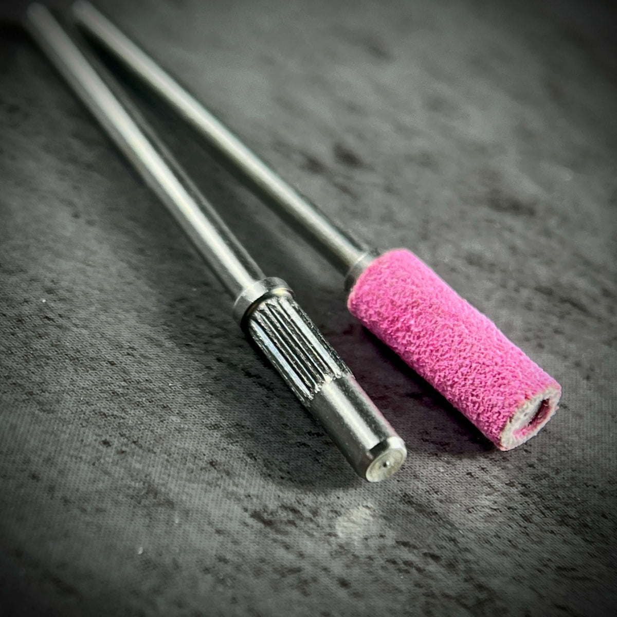 product image of Phenomenail® Precision Seamless Sanding Bands 240/180 Grit. Nail prep, shaping, refining, and surface smoothing. Image shows 2 drill bits Phenomenail® Precision Carbide Mini Mandrel 3.1mm one with and one without the sanding band