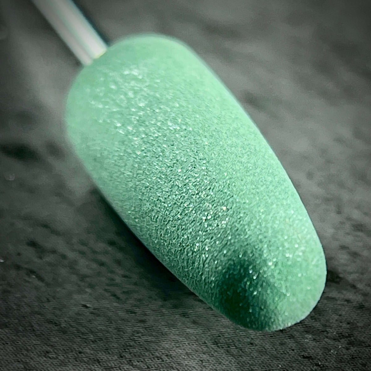 detailed close up of green Phenomenail® Precision Silicone Polisher | Medium