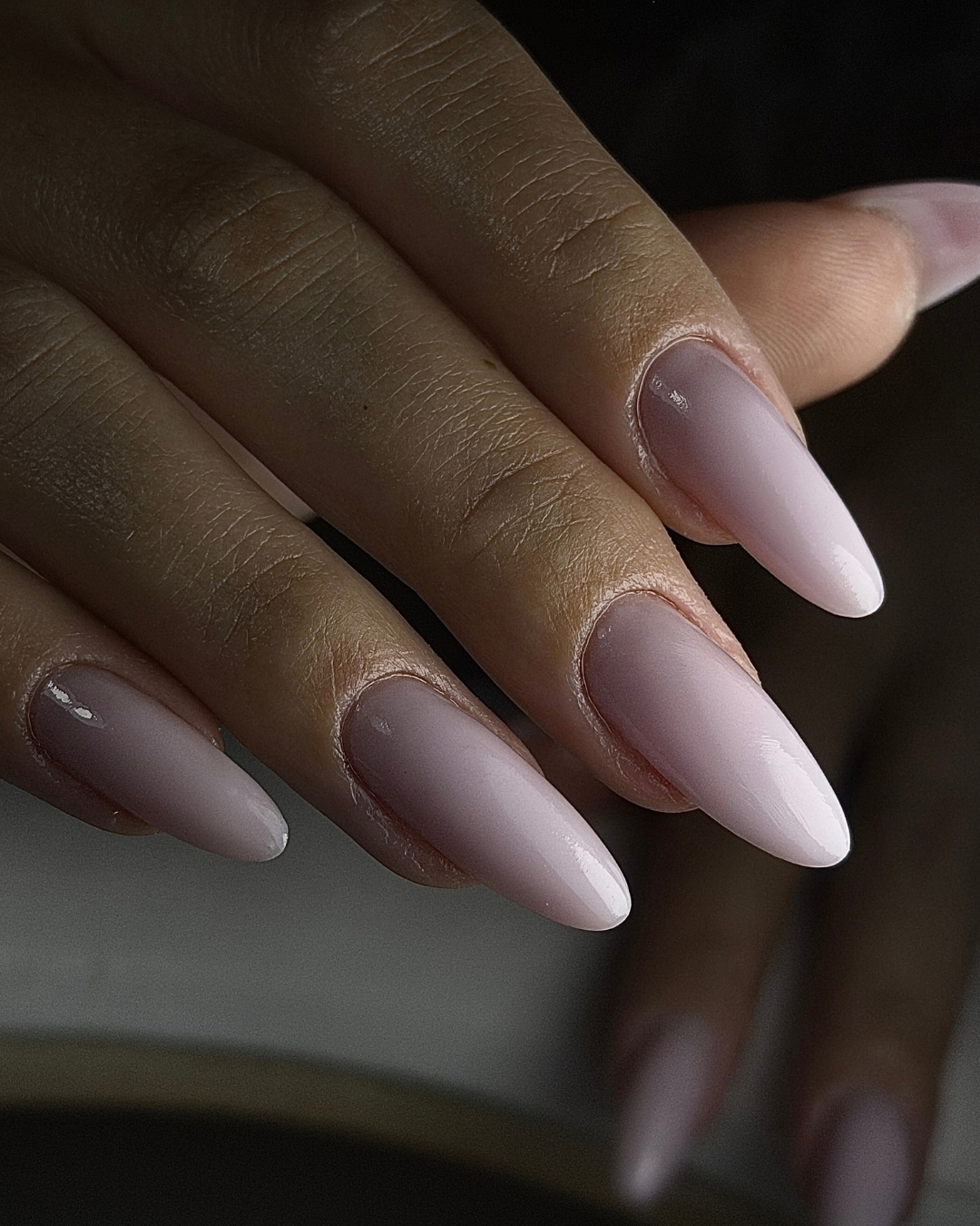 Close up of oval shaped nails displaying both Phenomenail™ STRUCT-R INCOGNITO and VEILED