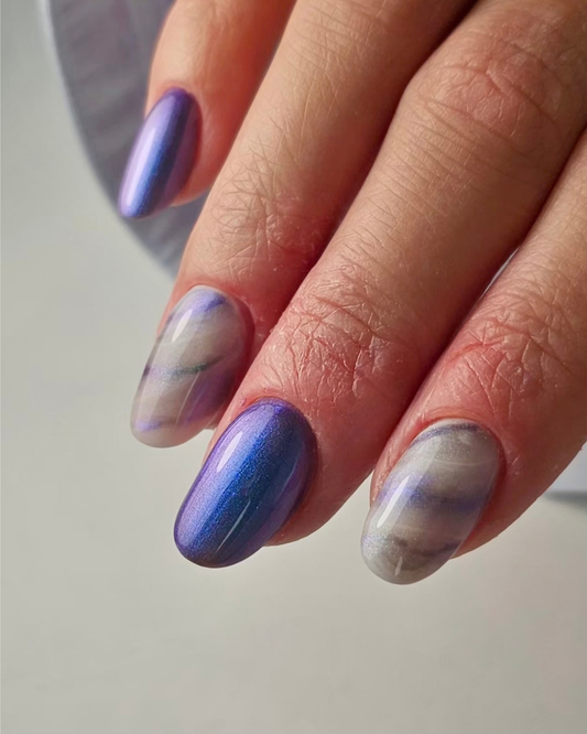 Close-up of a sapphire-to-lilac shimmer manicure with a metallic pearl finish created using Lantana professional gel polish.