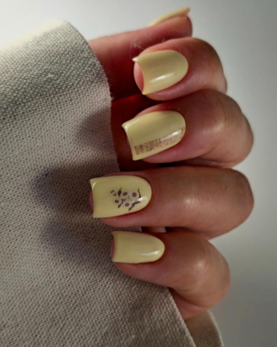 Close-up of a pastel yellow manicure created with Rebel Princess professional gel polish from Phenomenail™ M.E.T.A Pro.